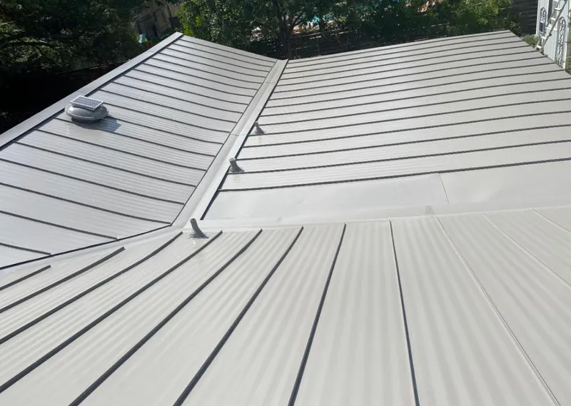 Solar attic fan installed on a metal roof for Roof Ventilation in Makaha